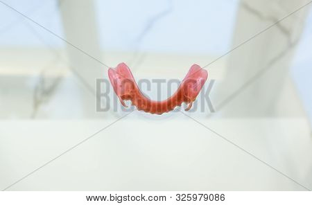 Large Image Of A Modern Denture Nylone On A Glass Background