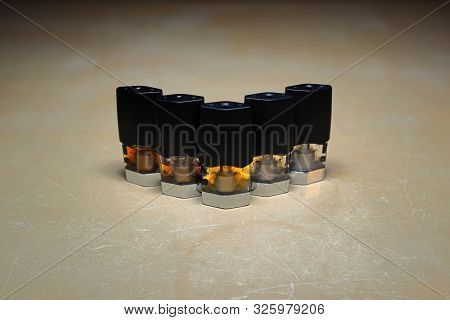 E-juice Vape Refill Pods With Liquids Of Different Shades Of Orange Arranged To Form A Gradient, Iso