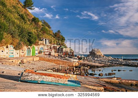 Ancona, Marche, Italy: The Metropolitan Beach Of Passetto With The Colored Doors Of The Caves Carved
