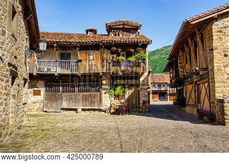 Stone Houses And Narrow Alley In Mountain Village In Northern Spain. Barcena Mayor.