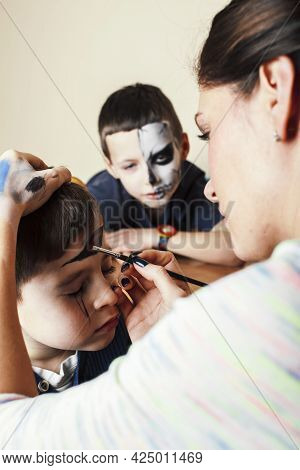 Little Cute Child Making Facepaint On Birthday Party, Zombie Apocalypse Facepainting, Halloween Prep