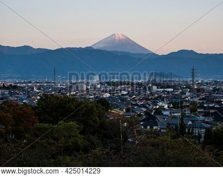 Kofu, Japan - October 25, 2017: View Of Kofu City With Mount Fuji On The Background At Sunset