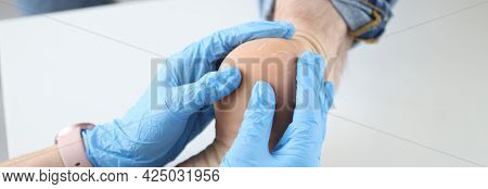 Doctor Dermatologist In Gloves Examining Patients Heel Closeup
