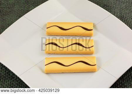 Macarpone Cream Filled Cookies With Chocolate On White Dessert Plate