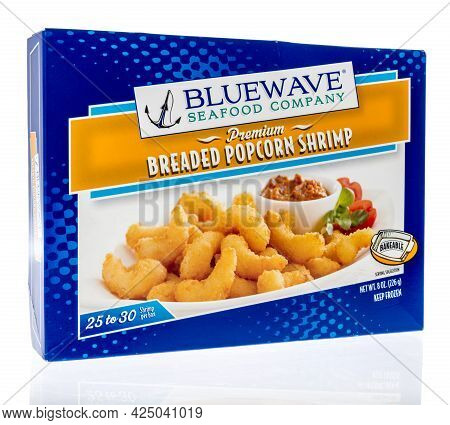 Winneconne, Wi - 27 June 2021:  A Package Of Bluewave Seafood Breaded Popcorn Shrimp On An Isolated 