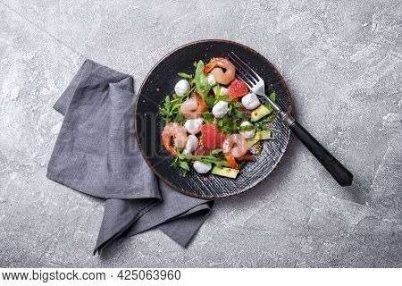 Healthy Salad With Fresh Arugula, Mozzarella Cheese, Tasty Shrimps, Grapefruit And Avocado