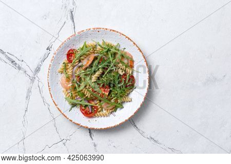 Pasta With Shrimps, Cherry Tomatoes, Arugula Leaves And Onion