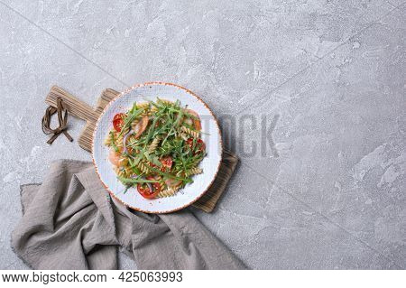 Pasta With Shrimps, Cherry Tomatoes, Arugula Leaves And Onion