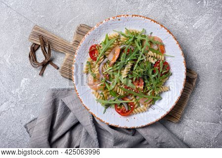 Pasta With Shrimps, Cherry Tomatoes, Arugula Leaves And Onion