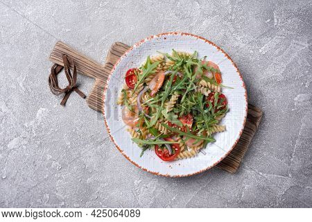 Pasta With Shrimps, Cherry Tomatoes, Arugula Leaves And Onion