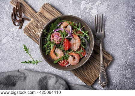 Healthy Salad With Fresh Arugula, Cherry Tomatoes, Tasty Shrimps And Onion