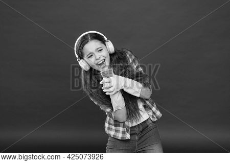 Cleaning Party. Girl Wear Headphones And Protective Gloves For Cleaning. Listening Music And Cleanin