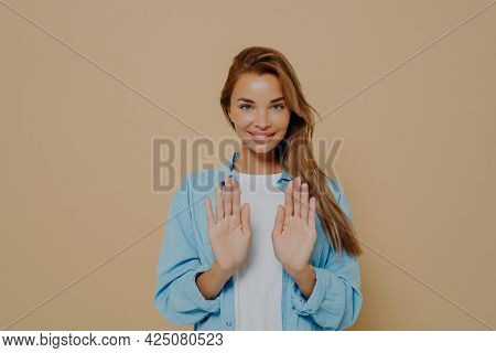 Smiling Young Female Model With Stright Long Hair Wearing Oversized Blue Shirt And White Tshirt Usin