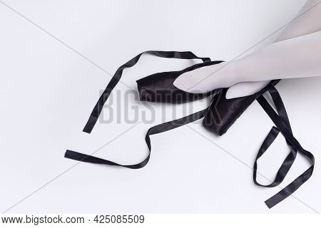 Closeup Of Ballet Dancer Sexy Legs In Laced Pointes Shoes. Posing With Straight And Crossed Legs.