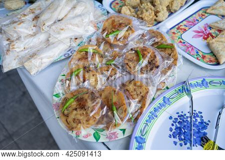 Bakwan With Green Chili In Plastic Wrap On A Serving Plate On The Table