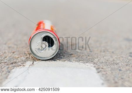 Aluminum Can Is Flat Lay,lying On The Road. Can Fall On The Street, It Can Be Recycled.summer Day Bl