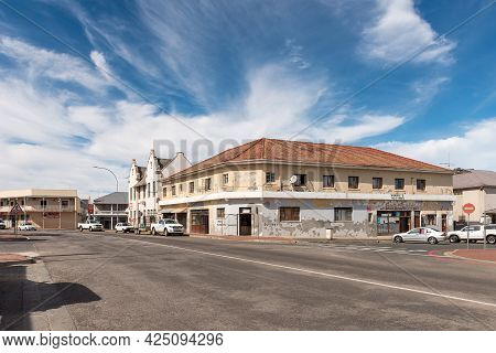 Caledon, South Africa - April 12, 2021: A Street Scene, With Old Buildings And Vehicles, In Caledon 