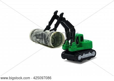 Abstract Photo With Toy Excavator Holding Bucket Of American Dollars Isolated On White Background