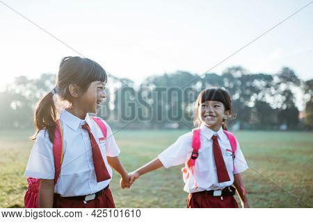 Primary School Student Friend Wearing Indonesian Uniform Going To School