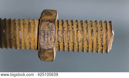 Old Rusty Bolt, Iron Rod With Screw Threads. Rusted Mechanical Components. Threaded Bolt And Nut Iso