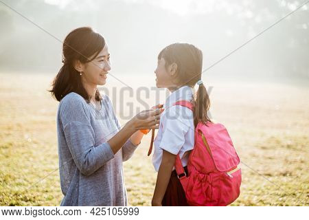 Primary School Student Taken By Mother To School In The Morning