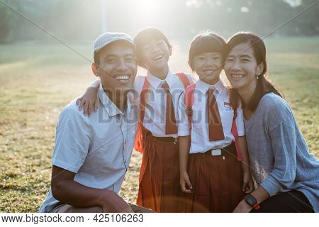 Family Asian With Their Primary School Student Kid