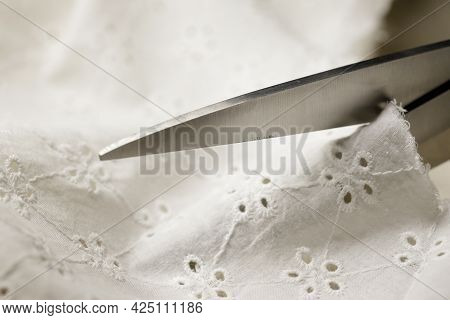 Someone Cuts Batiste With Steel Tailors Scissors