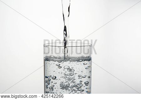 Close Up Pouring Purified Fresh Drink Water From The Bottle