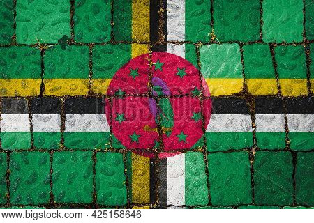 National Flag Of Dominica On Stone  Wall Background. Flag  Banner On  Stone Texture Background.