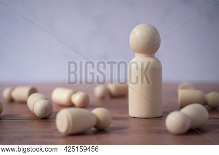 Wooden Figures Standing Out From Crowd.depicts The Ability Of Individual To Influence And Lead Follo
