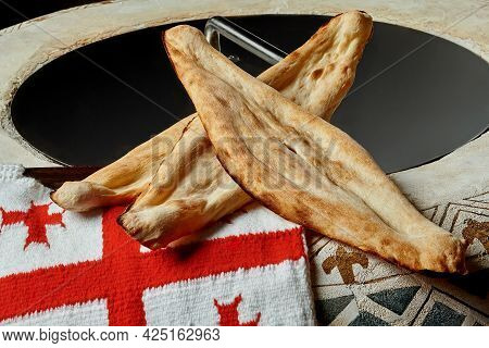 Traditional Georgian Bread Shotis Puri With National Flag On Tone Oven