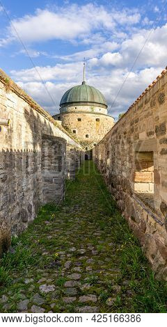 Vadstena, Sweden - May 23, 2021: Inner Pathway Between Walls Of The Castle In Swedish Town Vadstena 
