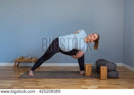 Woman Practicing Yoga, Doing Lunge Exercise, Side Angle Pose, Parsvakonasana,