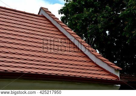 View Of The Roof Made Of Red Brick Burnt Tiles Of The Beaver Type Used In Central Europe On All Hist