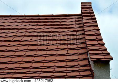 View Of The Roof Made Of Red Brick Burnt Tiles Of The Beaver Type Used In Central Europe On All Hist