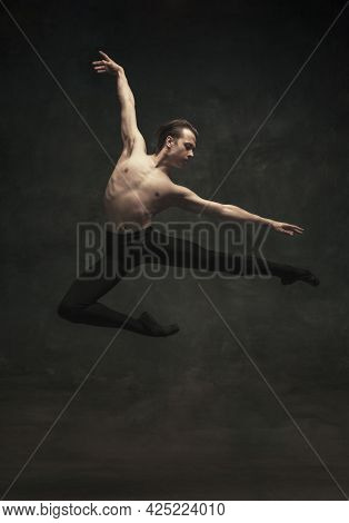 Young And Graceful Male Ballet Dancer Isolated On Dark Background. Art, Action, Inspiration Concept.
