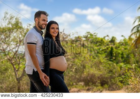 Photo Of A Young Couple, The Girl Is Pregnant