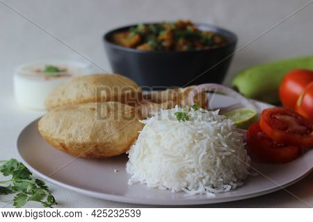 North Indian Vegetarian Meals. One Pot Preparation Of Lentil And Bottle Gourd Served With Steamed Ba