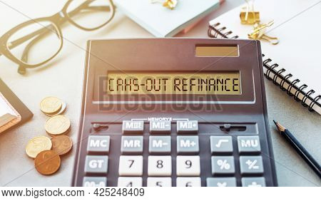 Word Cahs-out Refinance Written On Calculator On Office Table.