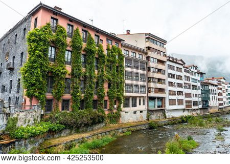 Traditional Local Houses In The Town Of Azkoitia Next To The Urola River, Gipuzkoa. Basque Country