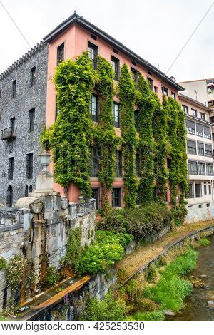 Beautiful Traditional Local Houses In The Town Of Azkoitia Next To The Urola River, Gipuzkoa. Basque
