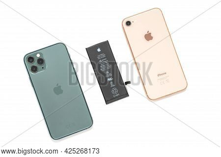 Russia, Rostov - May 29 2021: Different Modern Colorful Iphones And Put Out Uncharged Black Battery 