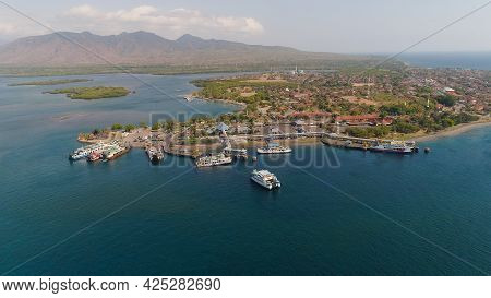Aerial View Ferry Port Gilimanuk With Ferry Boats, Vehicles. Ferries Transport Vehicles And Passenge