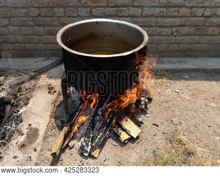 Preparing Food In A Wedding On Wooden Fire In A Village