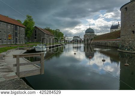 Vadstena, Sweden - May 23, 2021: Dramatic View On The Chanel Around Castle In Vadstena, Town In Midd
