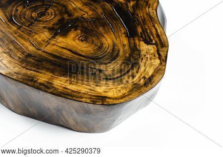 Cross Section Of The Tree. Saw Cut From A Tree Trunk. Wooden Surface. Cracks. On White Background.