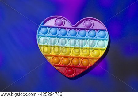 Fashionable Toy For Children Pop It. Anti-stress Finger Blisters. Heart Shaped Silicone Poppit Rainb