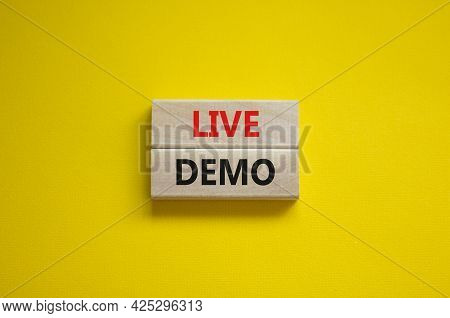 Live Demo Symbol. Concept Words 'live Demo' On Wooden Blocks On A Beautiful Yellow Background. Copy 