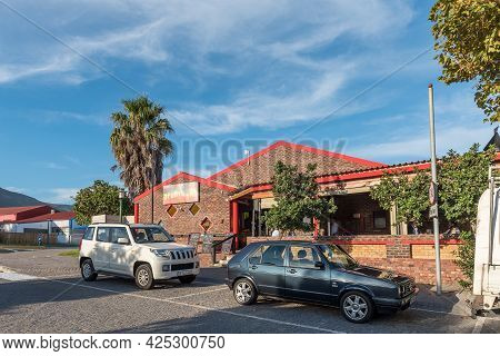 Kleinmond, South Africa - April 12, 2021: A Street Scene, With A Restaurant, At The Waterfront At Th