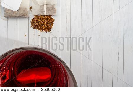 Fruit Tea In A Paper Bag And A Cup Of Tea. View From Above.